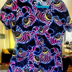 Vibrant, soft, Disney Cheshire Cat scrub top in size small.